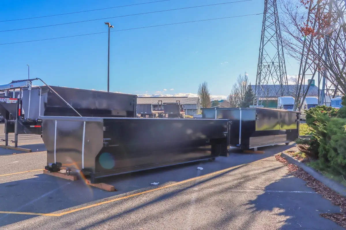 Roll-off dumpster ready for waste disposal at job site for 2 Yard Dumpster Rental in Rigby